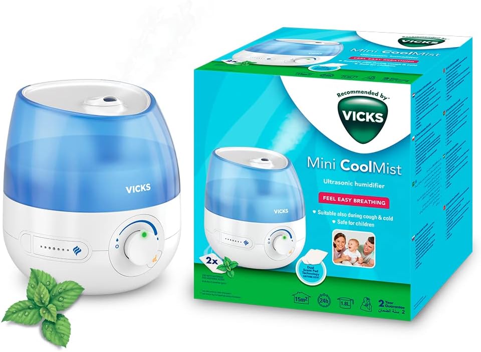 Vicks Mini Cool Mist ultrasonic humidifier - Adjustable mist control - 1.8 L Tank - Home use in bedrooms, offices, nurseries - Rooms to 15m2 - Quiet operation - Essential oil pads included - VUL525
