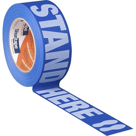 Shurtape 105156 CP 27P Multi-Surface Floor Masking Tape for Social Distancing with Stand Here Messaging, 48mm x 55m, Over 100ft per Roll, Blue